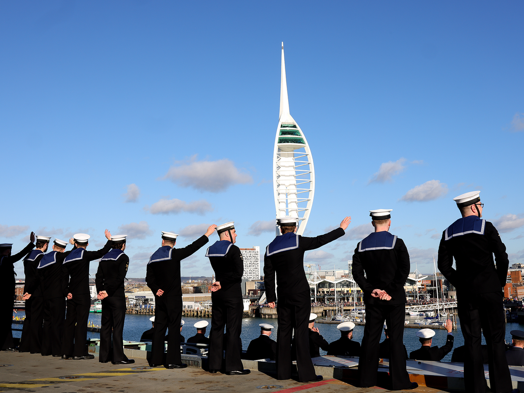 Sailors on the upper deck of HMS Prince of wales returns to Portsmouth