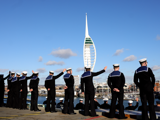 Sailors on the upper deck of HMS Prince of wales returns to Portsmouth