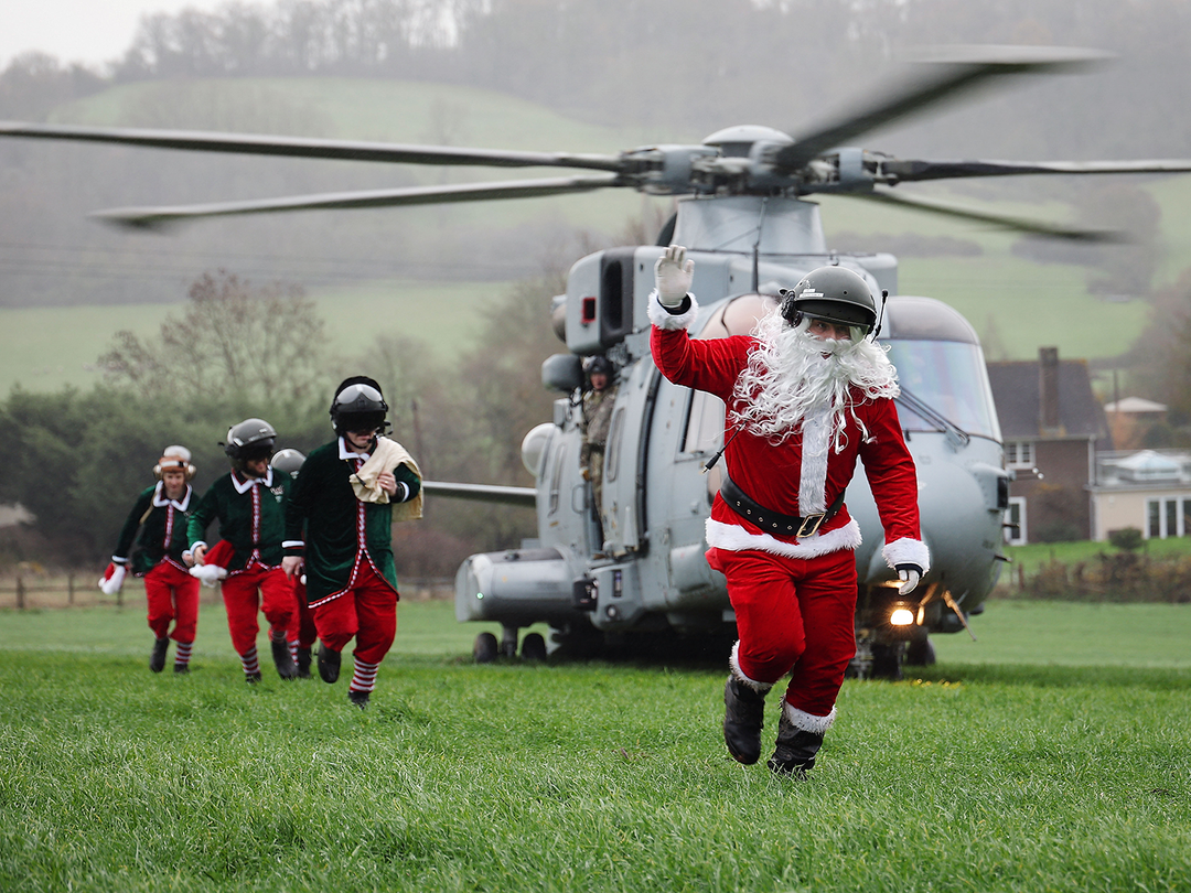 santa leaving a military helicopter