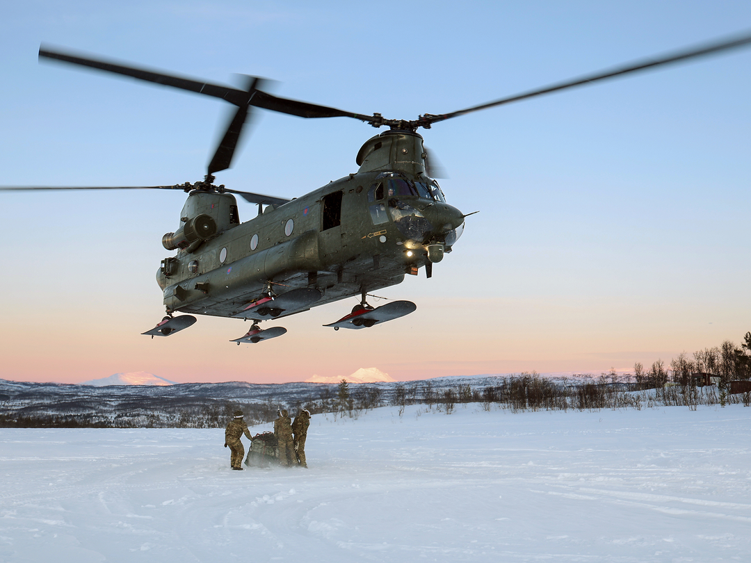 A chinook helicopter with skis