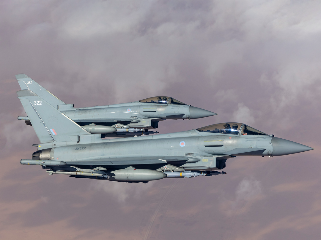 Two RAF Typhoon aircraft flying over the middle east