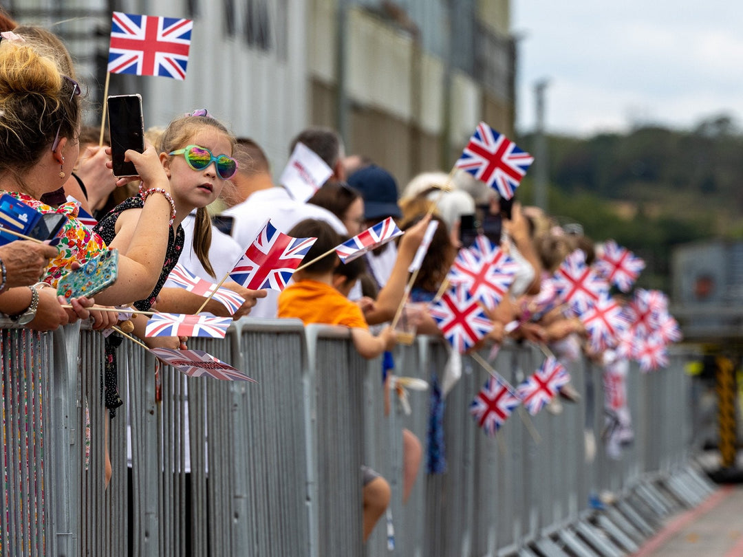 Families gather on the docks awaiting HMS Somerset's arrival.
