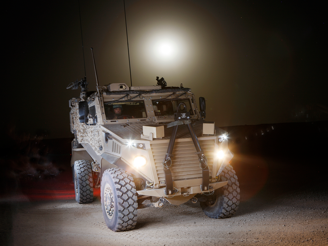 British Army Foxhound at Night Camp Bastion June 2012